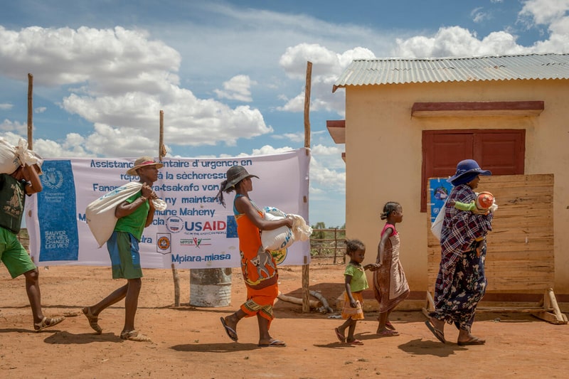 Beneficiaries taking away food they received at the WFP Food distribution in Maheny (Beloha Region). Photo: WFP/Giulio d'Adamo 